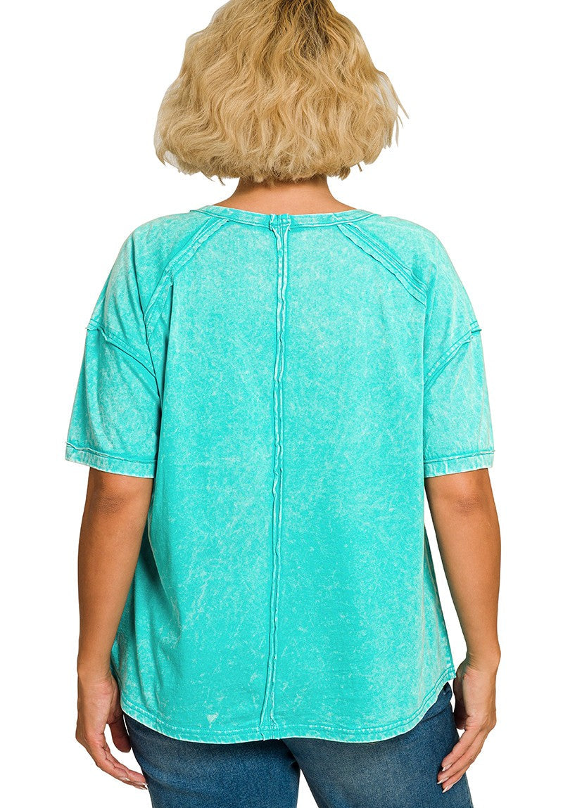 Back view of woman wearing a turquoise t-shirt on a white background